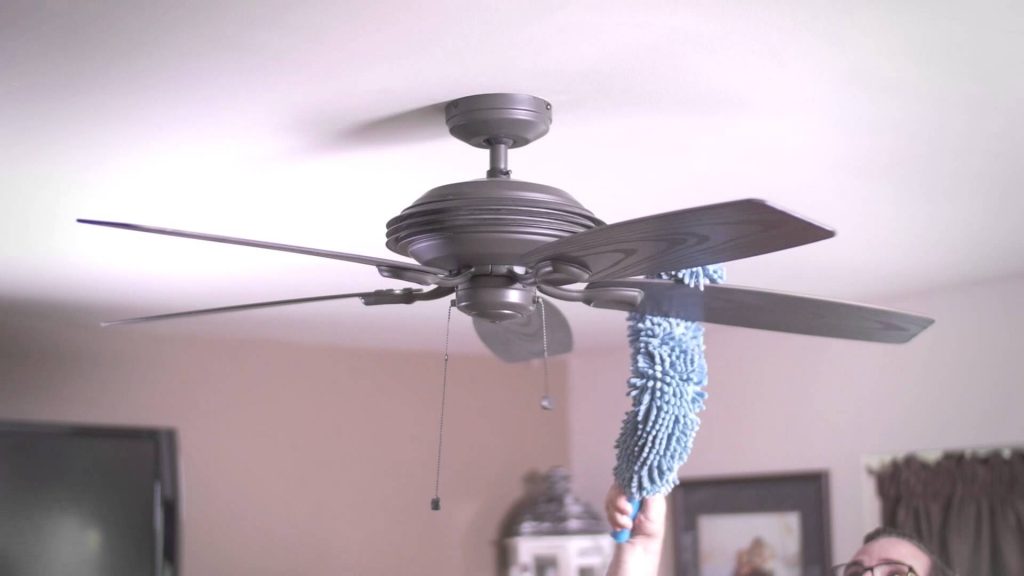 Dusting-a-ceiling-fan-top-to-bottom-house-keeping-spring-cleaning